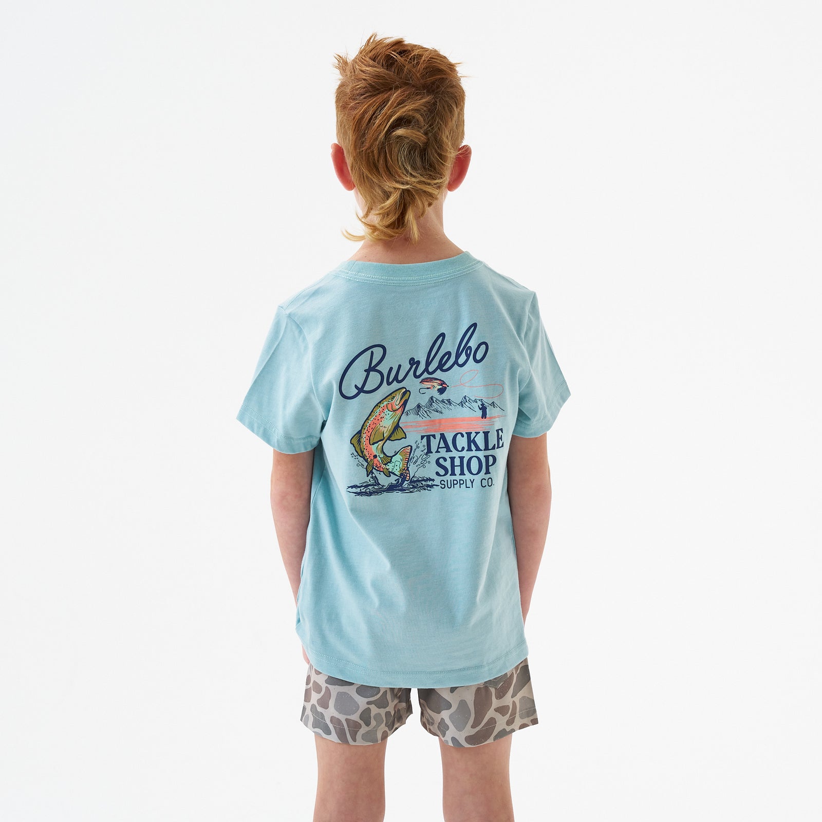Child wearing Burlebo Youth Tackle Shop Short Sleeve T-Shirt in Sky Blue in front of a white backdrop.