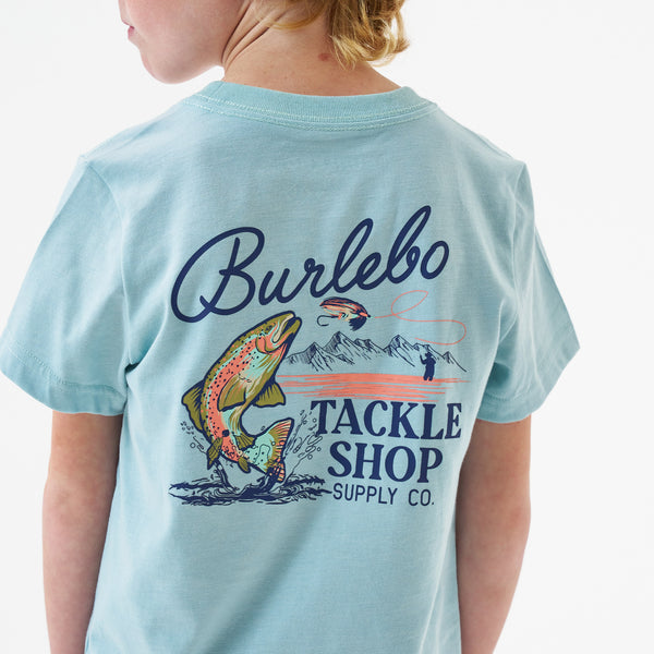 Child wearing Burlebo Youth Tackle Shop Short Sleeve T-Shirt in Sky Blue in front of a white backdrop.