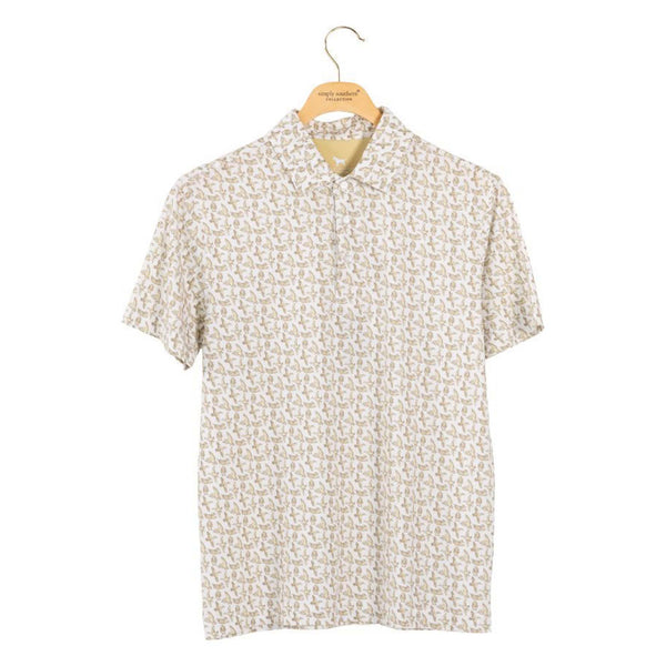 Short-sleeve polo with a subtle pattern on a hanger against a white background
