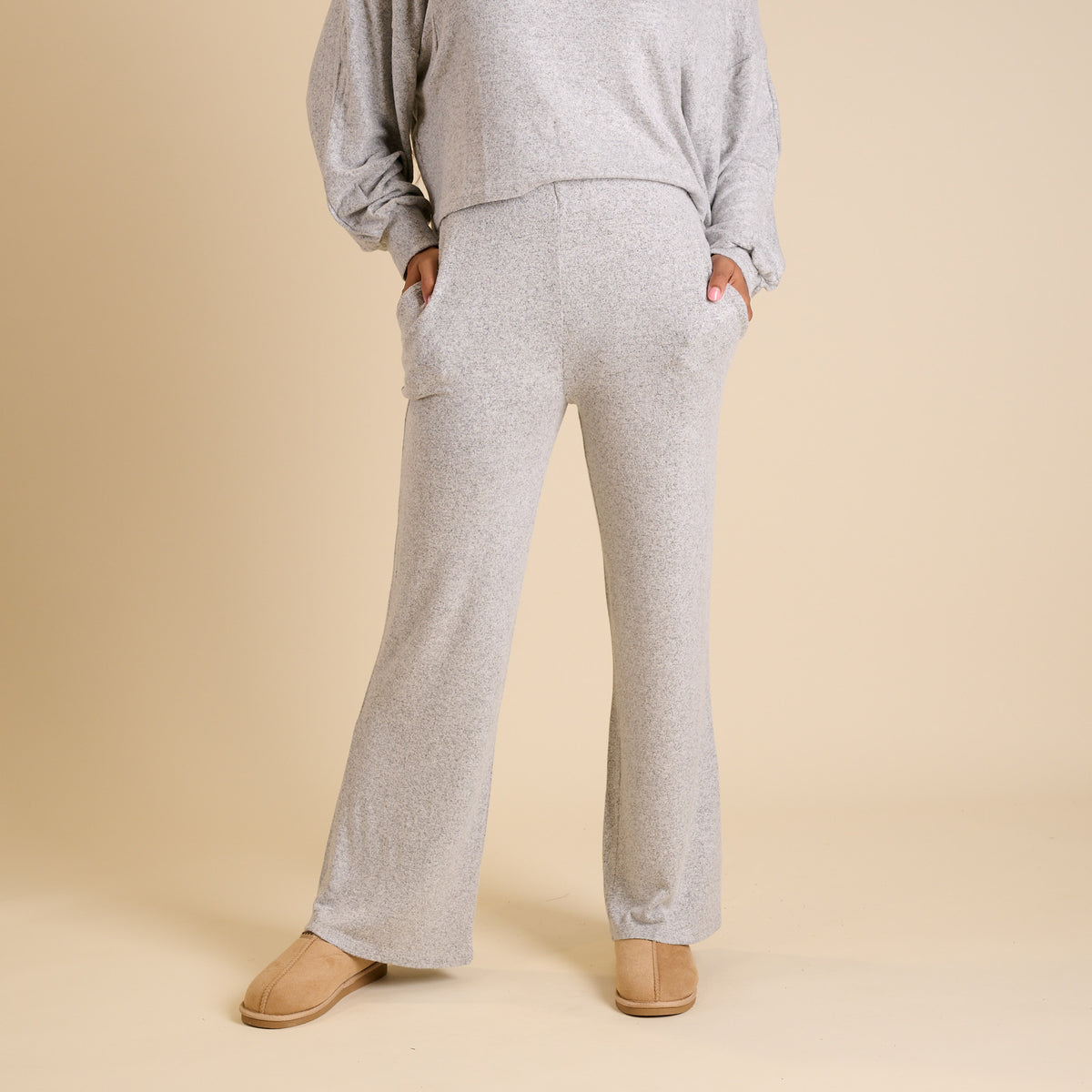 Woman wearing a grey lounge set.