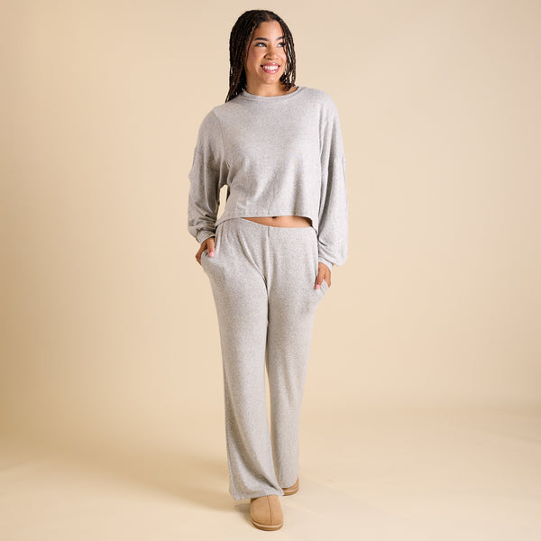 Woman wearing a grey lounge set.