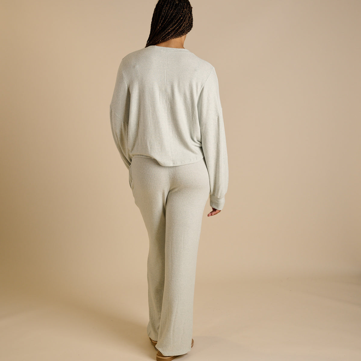 Woman wearing a mint lounge set.