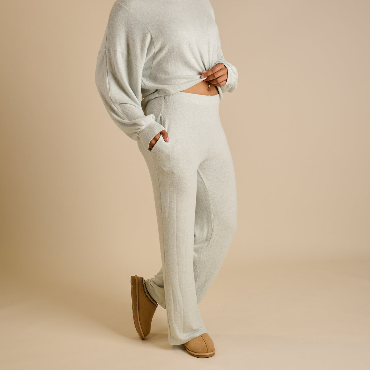 Woman wearing a mint lounge set.