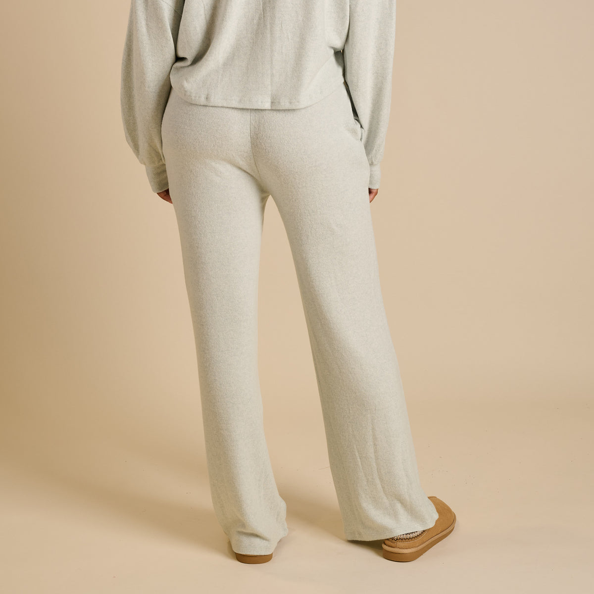 Woman wearing a mint lounge set.