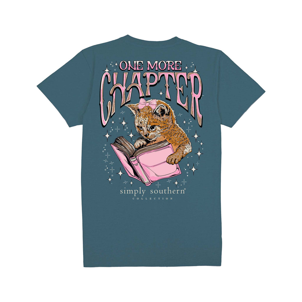 Comet blue short sleeve shirt with the phrase 'One more chapter' and a cat reading a pink book surrounded by sparkling stars.