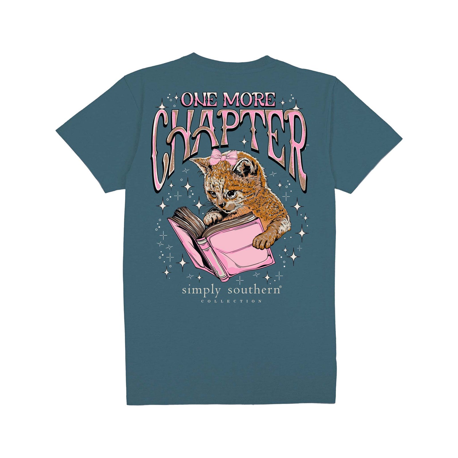 Comet blue short sleeve shirt with the phrase 'One more chapter' and a cat reading a pink book surrounded by sparkling stars.