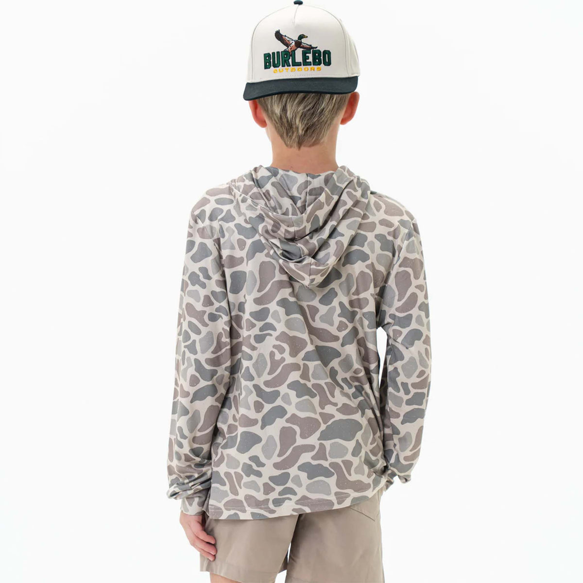 Back view of Burlebo Youth Performance Hoodie shown on a young boy wearing the Classic Deer Camo pattern. 
