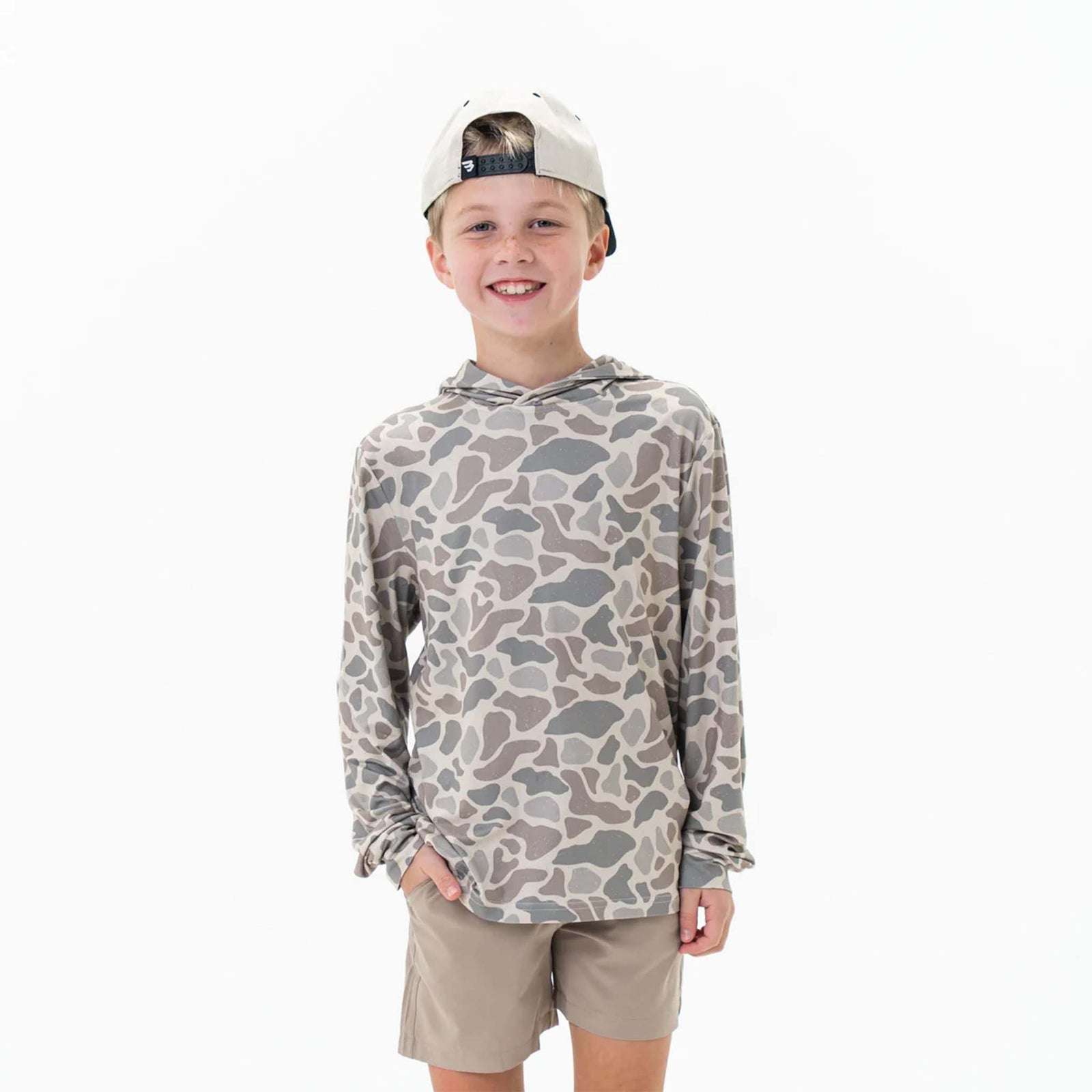 Burlebo Youth Performance Hoodie shown on a young boy wearing the Classic Deer Camo pattern. 