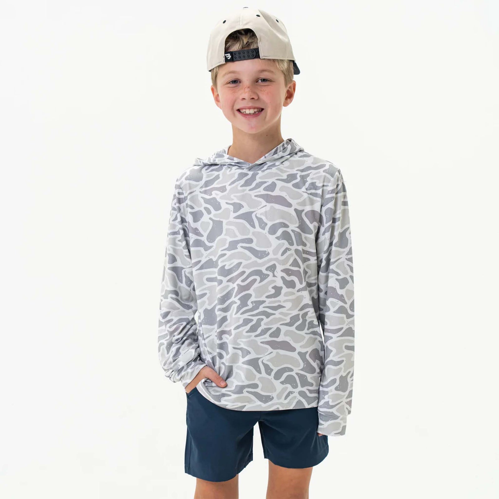 Burlebo Youth Performance Hoodie shown on a young boy wearing the White Camo pattern. 