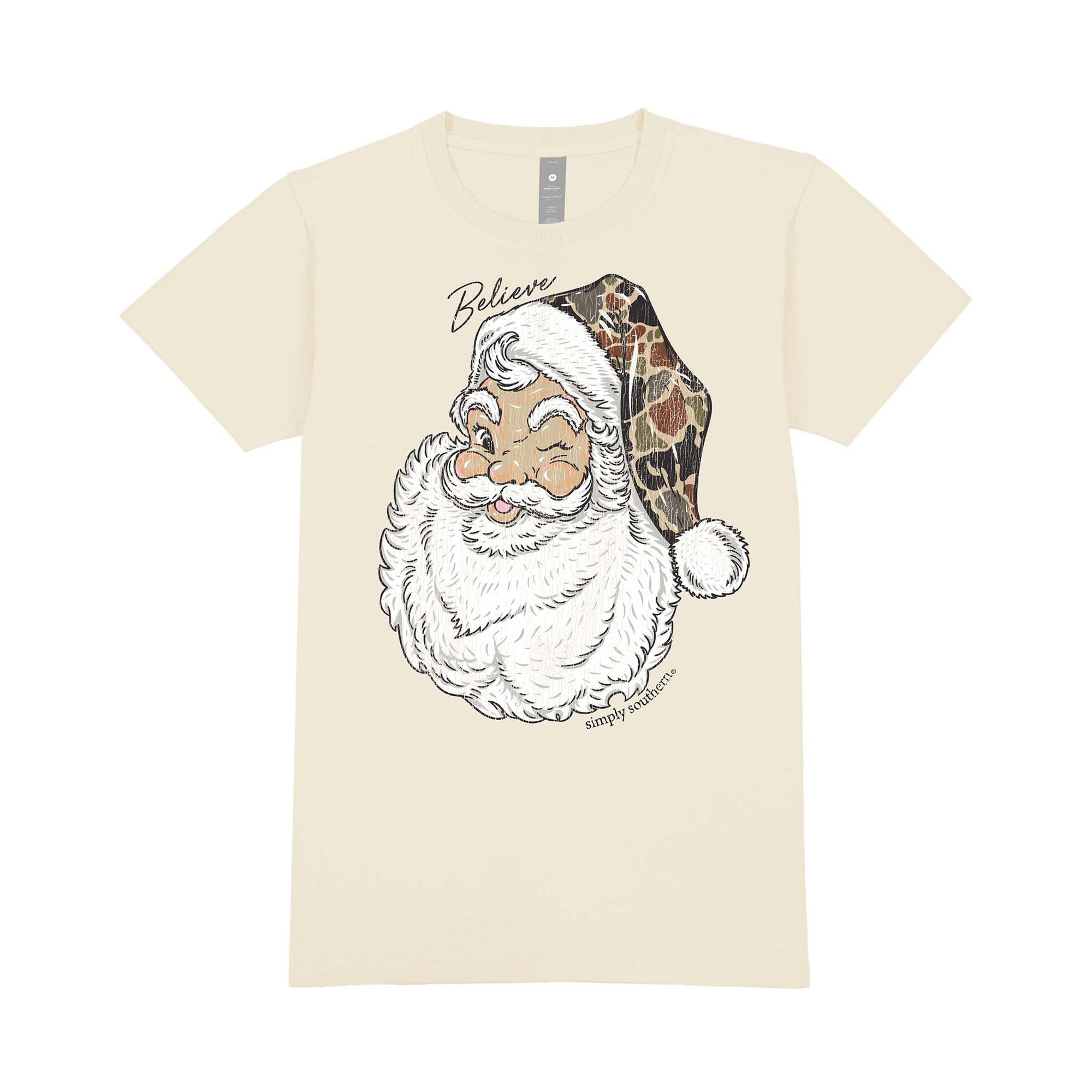 Beige youth Simply Southern tee with a vintage winking Santa graphic wearing a camo hat and the word ‘Believe’ written above.