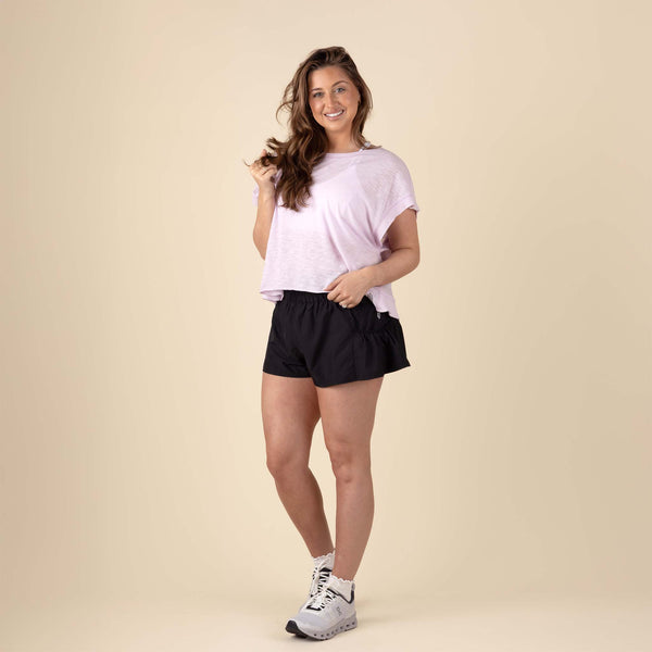 Free People Movement Athletic Shorts in Black – lightweight workout shorts with an elastic waistband and side pockets.