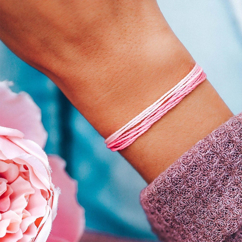 Pura Vide Pink and White Bracelet shown on a women&#39;s wrist